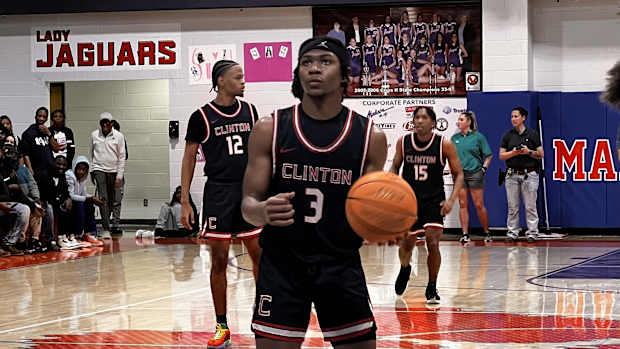Clinton guard Trey Alexander steps up to shoot a key free throw against Madison Central in Friday night's regular-season finale road win over the Jaguars.